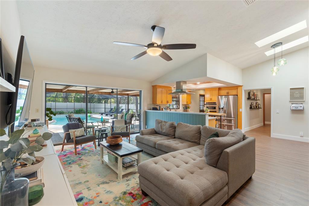 2941 Chelsea Woods Drive Valrico, FL 33596 - Photo 14 of 48 a living room with furniture ceiling fan and a large window