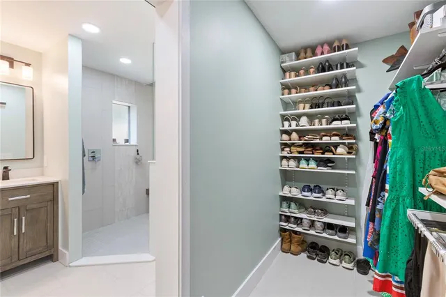 a bedroom with furniture and a window