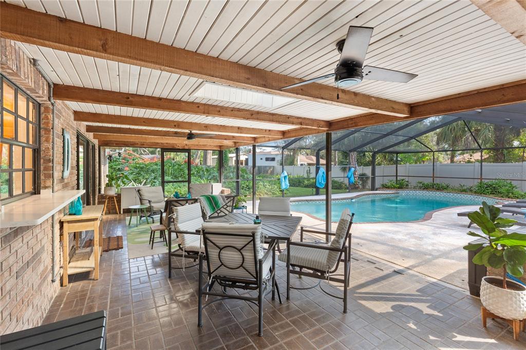 2941 Chelsea Woods Drive Valrico, FL 33596 - Photo 33 of 48 a patio with yard glass top table and chairs
