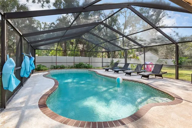 a view of a swimming pool with a patio