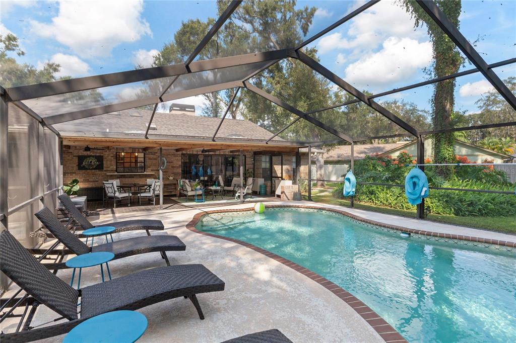 2941 Chelsea Woods Drive Valrico, FL 33596 - Photo 36 of 48 a view of a backyard with swimming pool