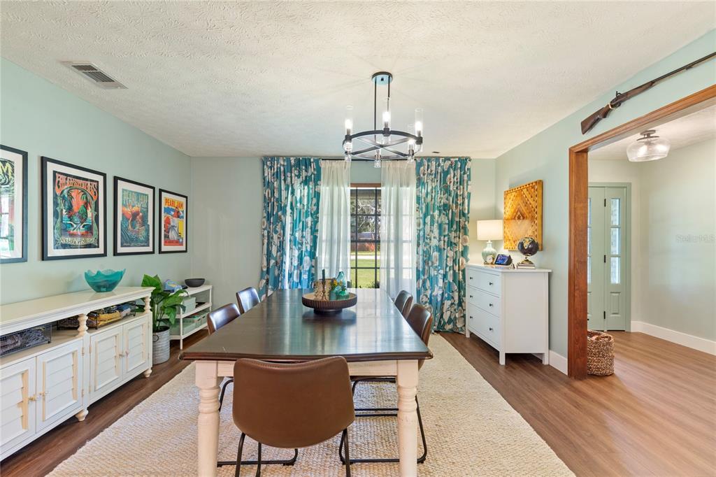 2941 Chelsea Woods Drive Valrico, FL 33596 - Photo 8 of 48 a view of a dining room with furniture window and wooden floor