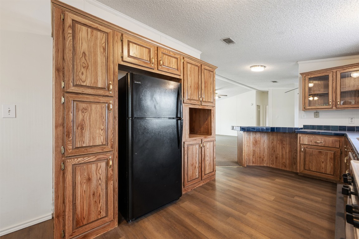 635 West Dittmar Road Austin, TX 78748 - Photo 14 of 32 a kitchen with granite countertop stainless steel appliances a refrigerator and cabinets