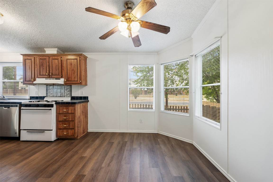 635 West Dittmar Road Austin, TX 78748 - Photo 18 of 32 a kitchen with a wooden floor and a window