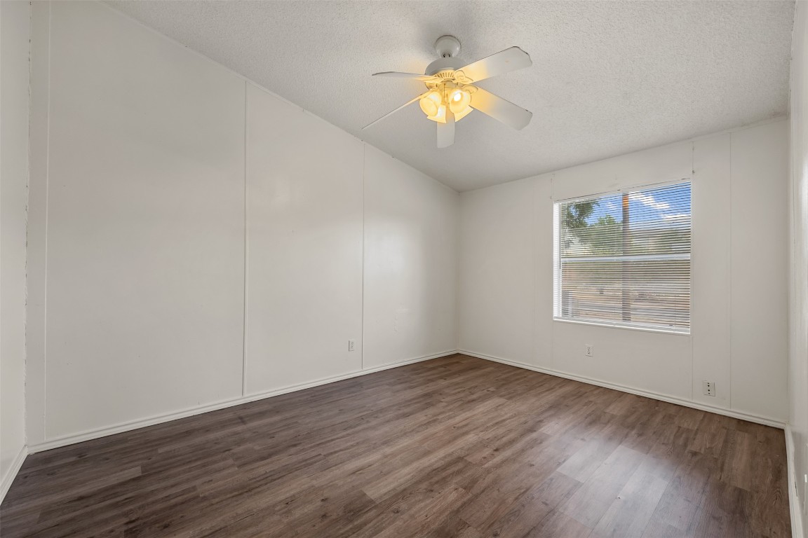 635 West Dittmar Road Austin, TX 78748 - Photo 26 of 32 an empty room with wooden floor and window