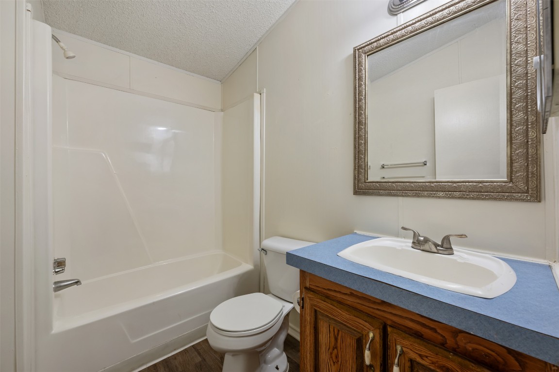 635 West Dittmar Road Austin, TX 78748 - Photo 27 of 32 a bathroom with a sink toilet and shower