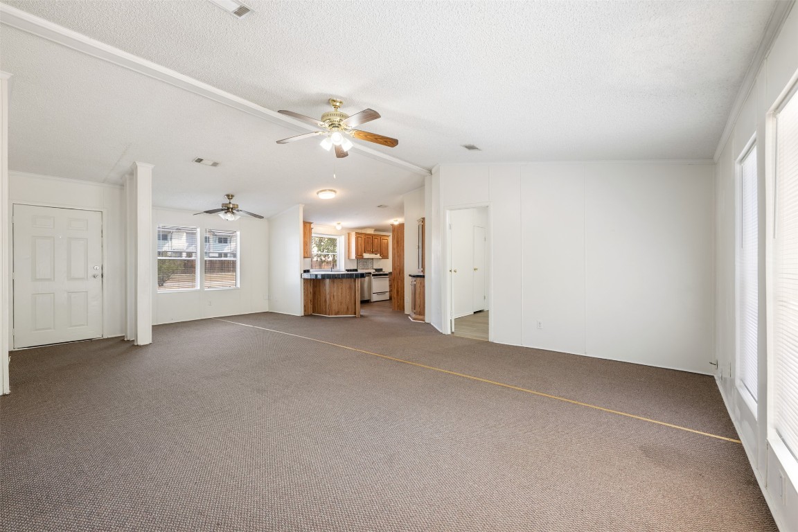 635 West Dittmar Road Austin, TX 78748 - Photo 7 of 32 a view of a livingroom with furniture and a ceiling fan
