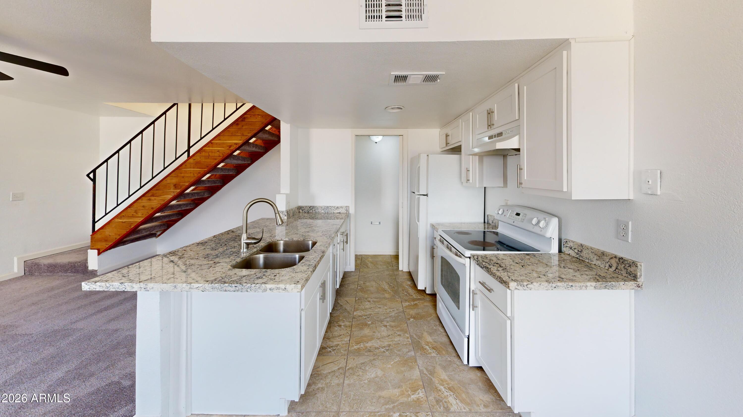 2629 West Ocotillo Road, Unit 2 Phoenix, AZ 85017 - Photo 13 of 21 2629-W-Ocotillo-Rd-Kitchen 1