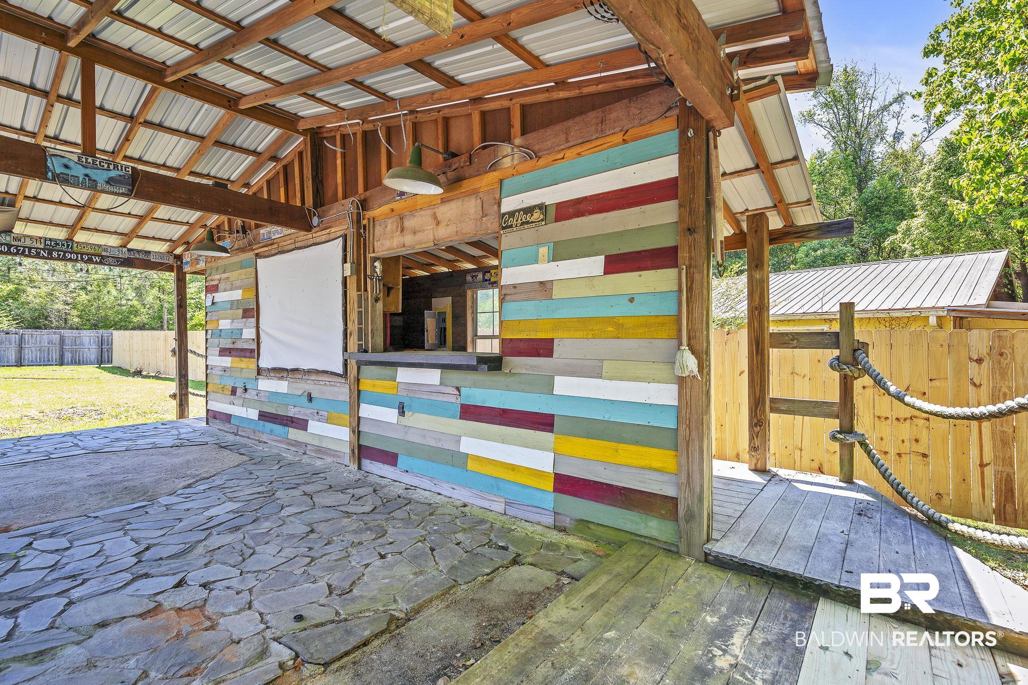 11964 Stroh Road Daphne, AL 36527 - Photo 53 of 58 View of patio / terrace featuring an outbuilding and an exterior structure