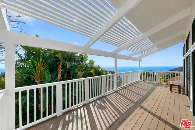 a view of balcony with wooden floor