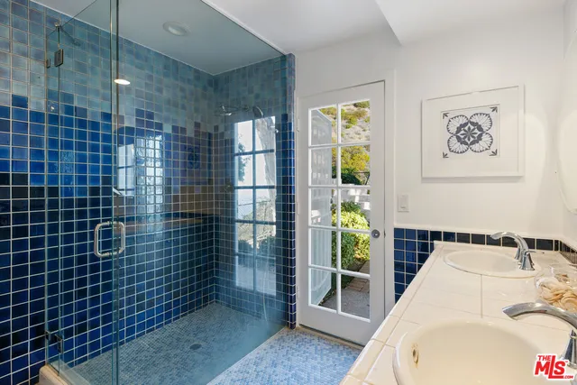 a bathroom with a bathtub and shower