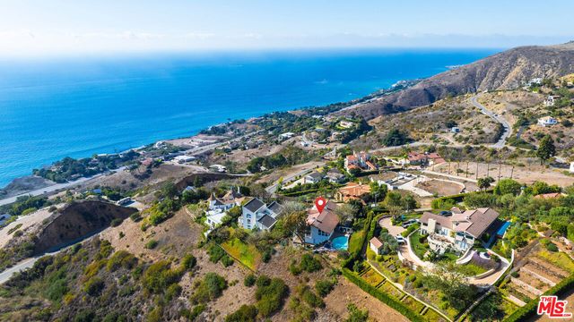 an aerial view of beach and ocean