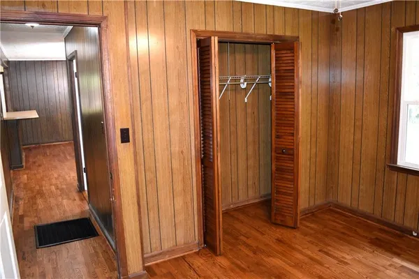 an empty room with wooden floor