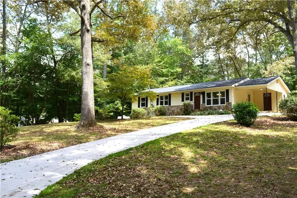 front view of a house with a yard