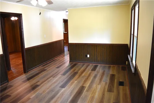 a bathroom with a toilet a sink and a window