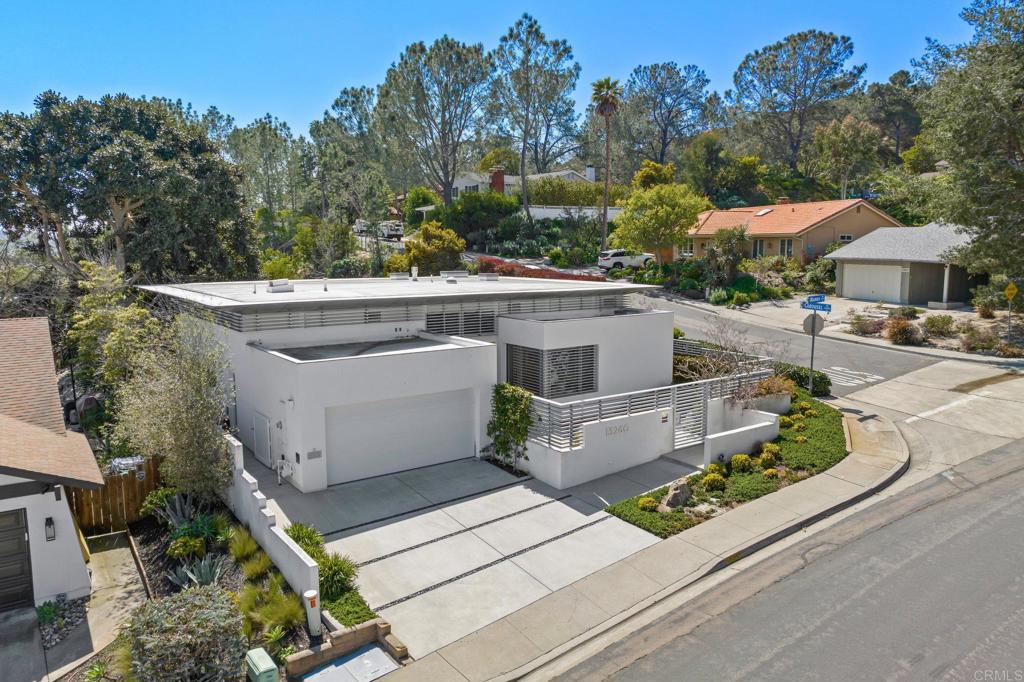 13260 Mango Drive Del Mar, CA 92014 - Photo 2 of 46 a view of a patio with table and chairs under an umbrella