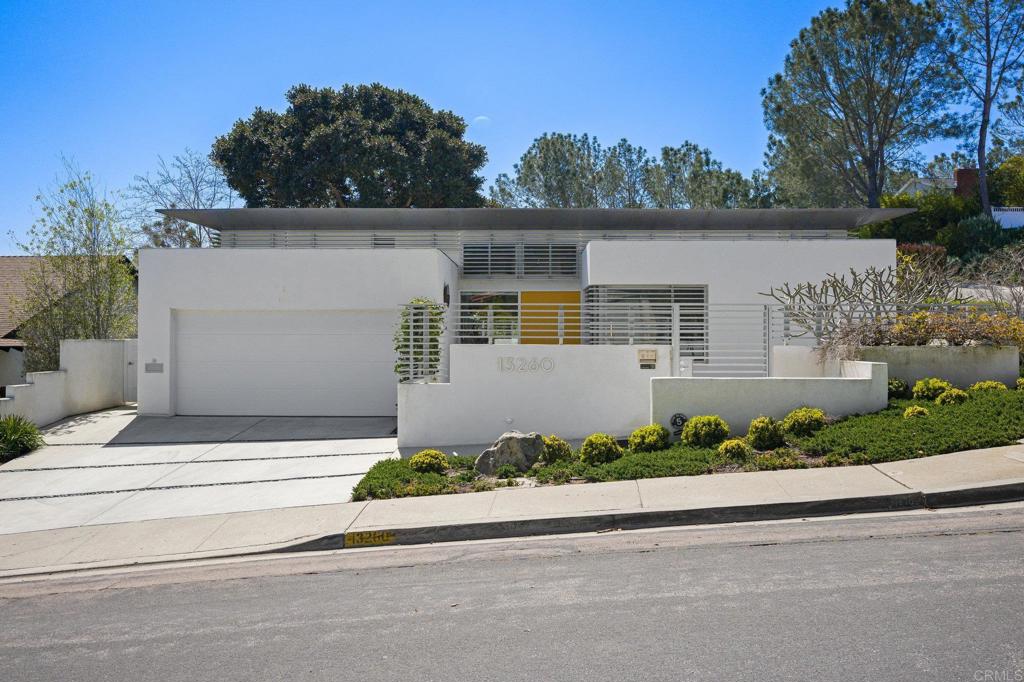 13260 Mango Drive Del Mar, CA 92014 - Photo 35 of 46 front view of a house with a bench