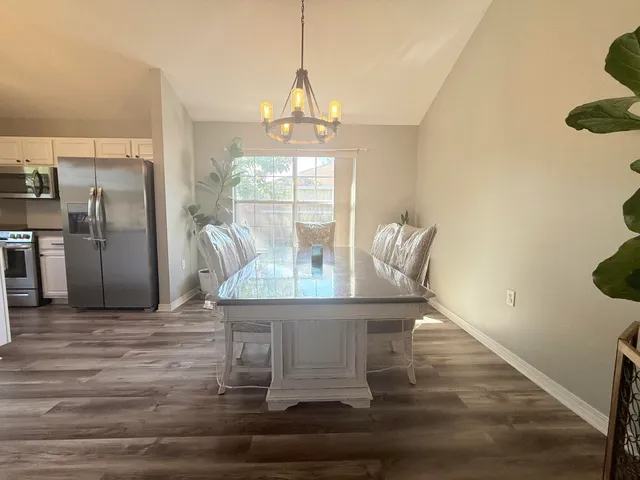 a bathroom with a sink a mirror and a shower