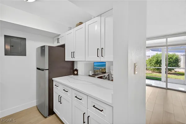 a bed room with a bed and a chair