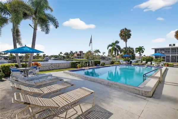 a view of a swimming pool with a bench