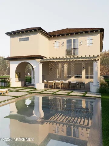 a view of a house with pool and chairs