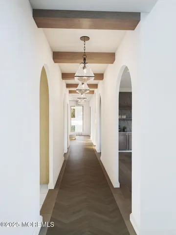 a view of a hallway with a chandelier