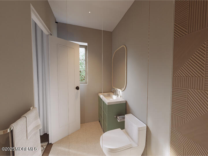 186 Whalepond Road Eatontown, NJ 07724 - Photo 9 of 28 a white toilet sitting next to a bathroom sink