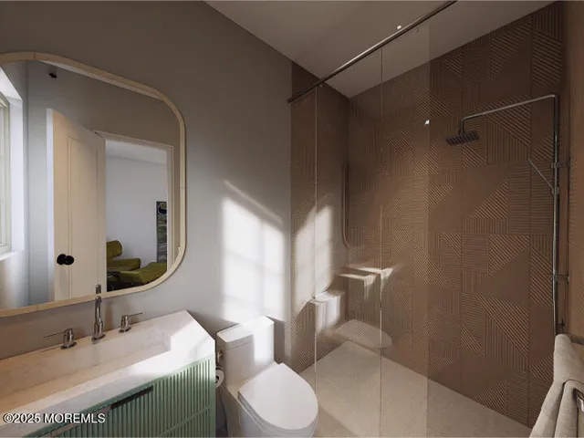 a bathroom with a sink toilet and mirror