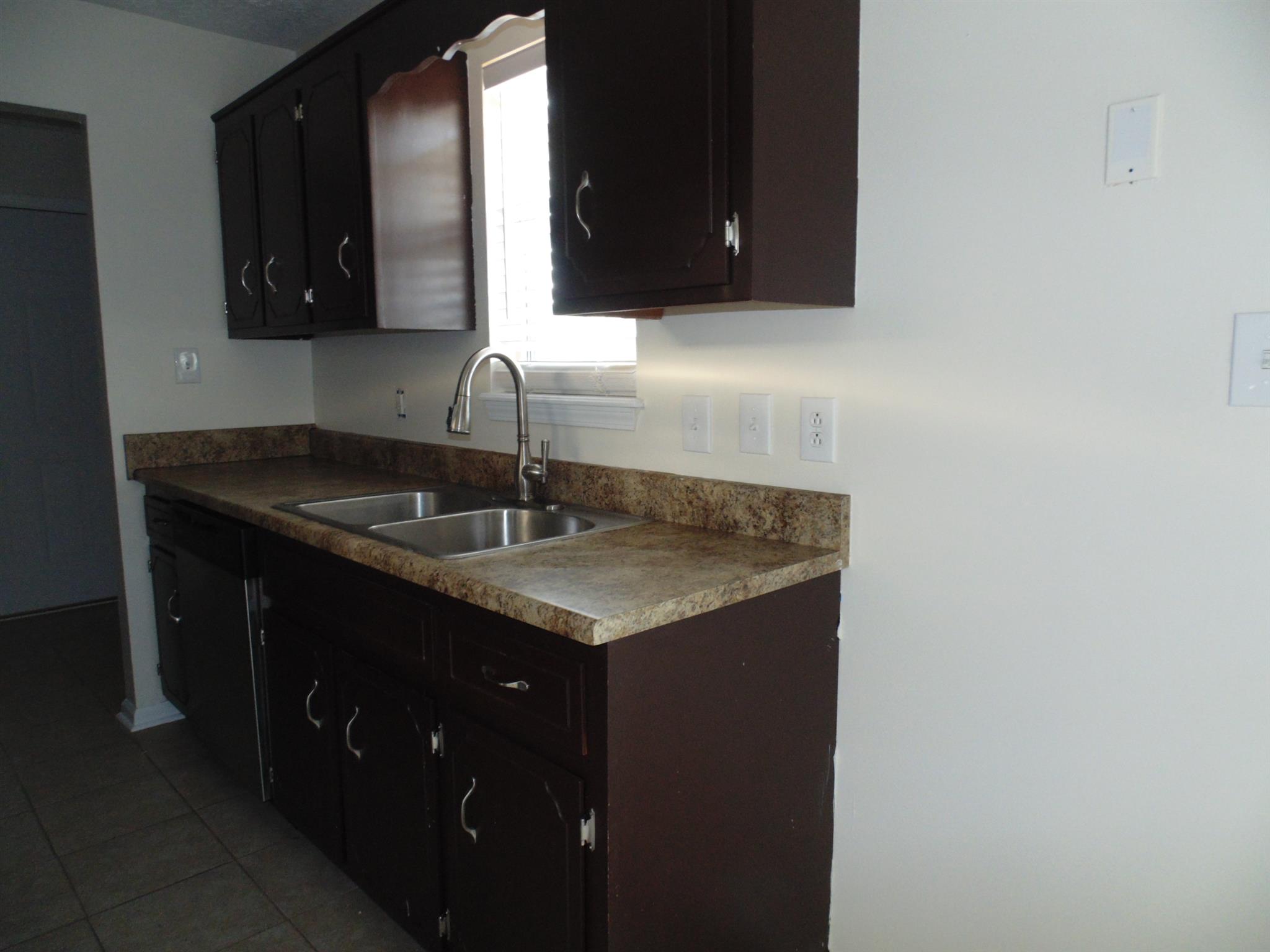 8671 Pembroke Oak Grove Road Oak Grove, KY 42262 - Photo 4 of 11 a kitchen with a sink and a mirror