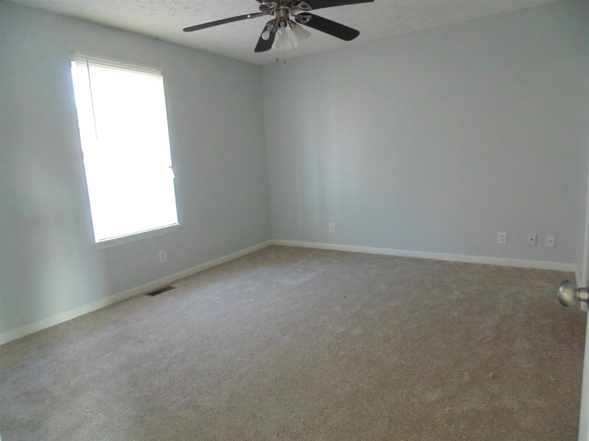 8671 Pembroke Oak Grove Road Oak Grove, KY 42262 - Photo 9 of 11 an empty room with a window