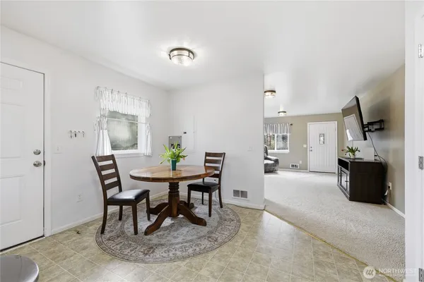 a view of a dining room with furniture