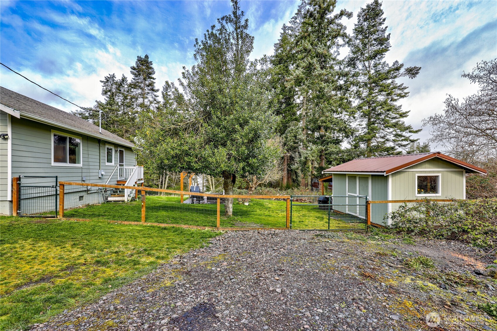 331 Bachelor Road Sequim, WA 98382 - Photo 23 of 36 a view of a house with a yard and sitting area
