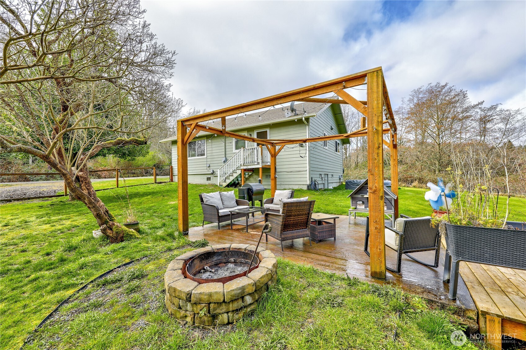 331 Bachelor Road Sequim, WA 98382 - Photo 26 of 36 a backyard of a house with outdoor seating