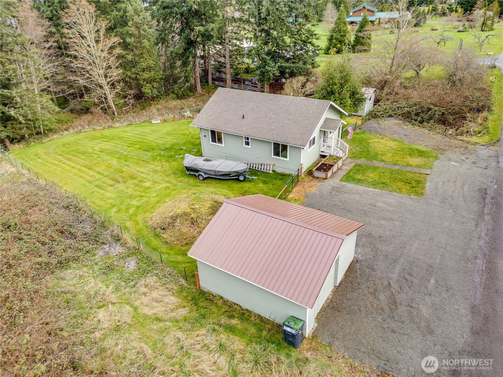 331 Bachelor Road Sequim, WA 98382 - Photo 28 of 36 a view of a back yard of the house with a yard