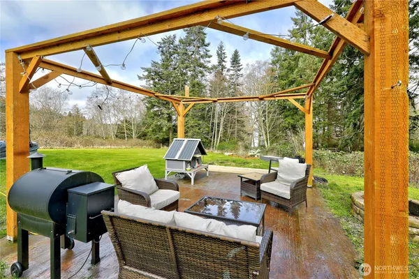 a view of an outdoor sitting area with furniture