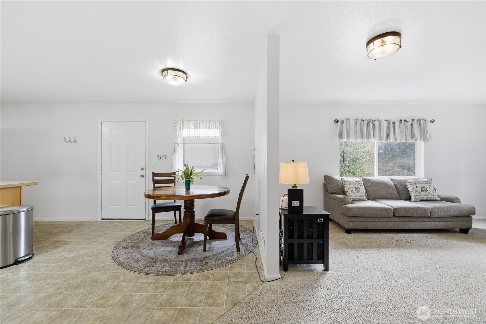 331 Bachelor Road Sequim, WA 98382 - Photo 7 of 36 a living room with furniture a rug and a window