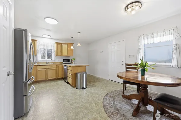 a view of a kitchen and dining room