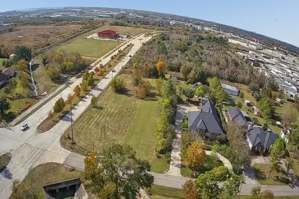 a view of a field with an ocean