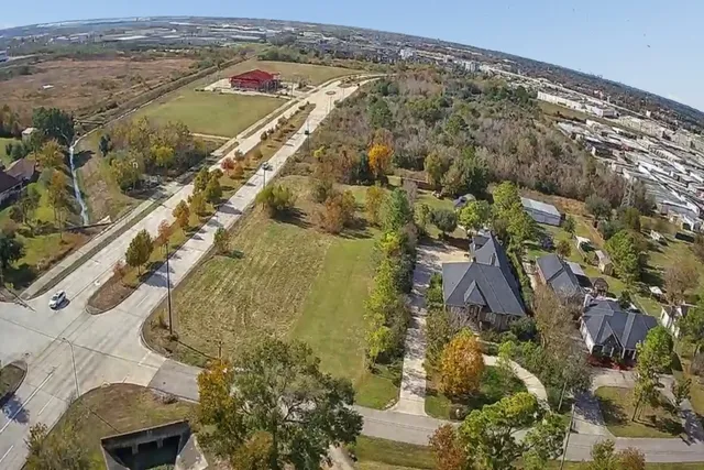 a view of a field with an ocean