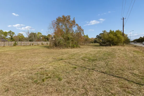 a view of a field with an ocean view