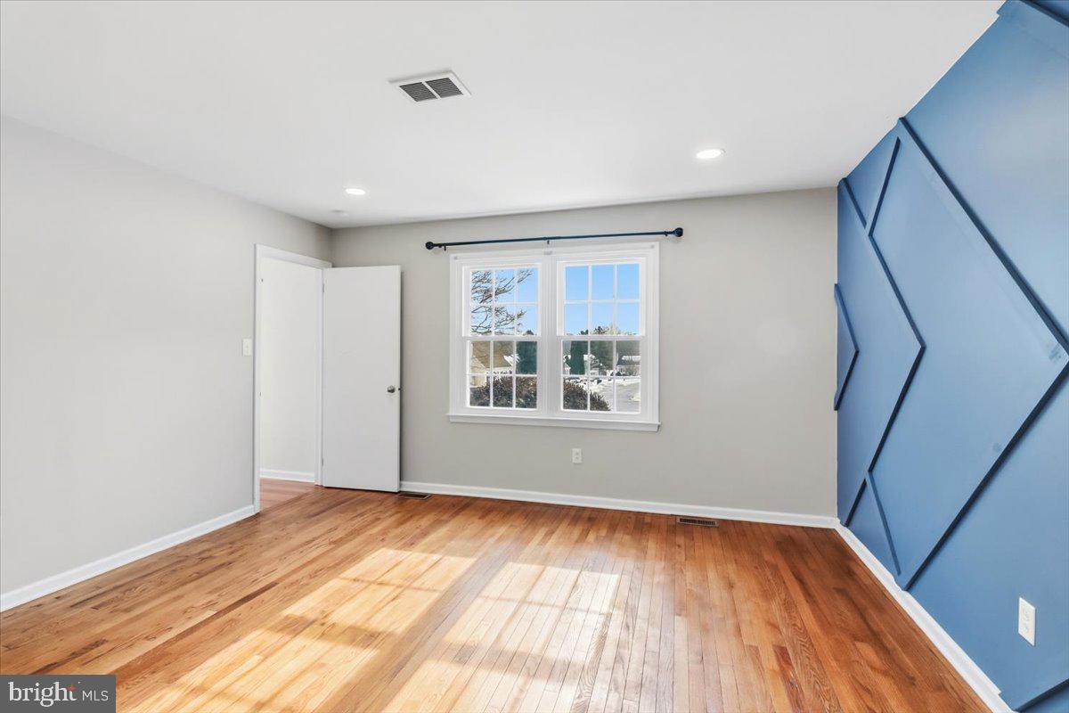 11 North Williamson Road Avondale, PA 19311 - Photo 11 of 36 a view of empty room with wooden floor and fan
