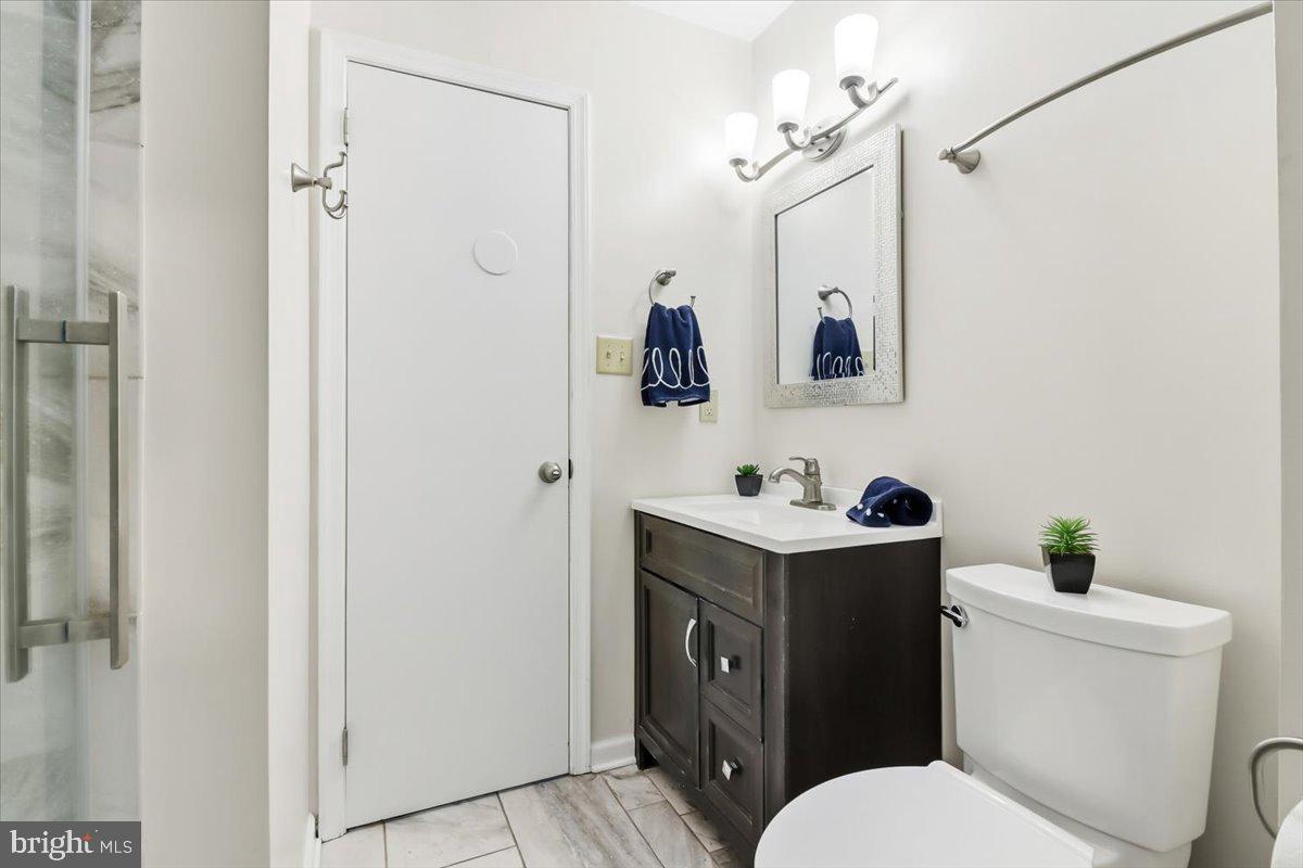 11 North Williamson Road Avondale, PA 19311 - Photo 12 of 36 a bathroom with a toilet a sink and mirror