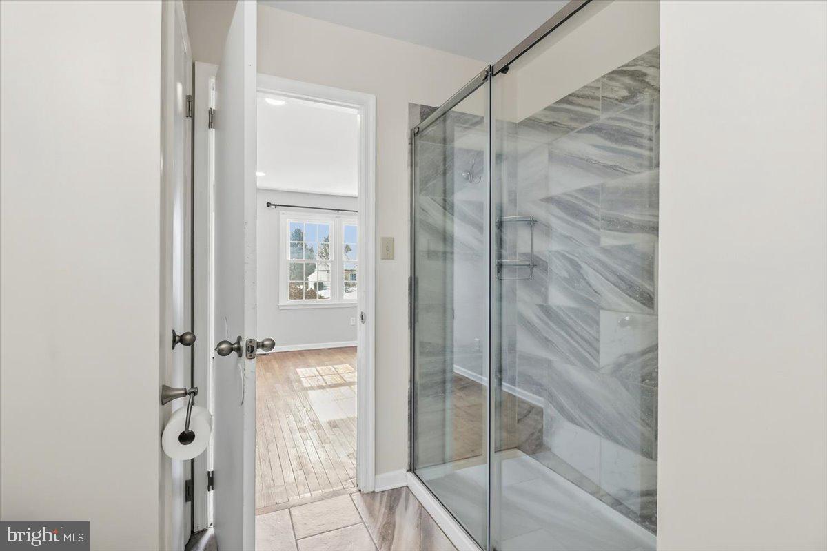 11 North Williamson Road Avondale, PA 19311 - Photo 13 of 36 a bathroom with a glass shower door