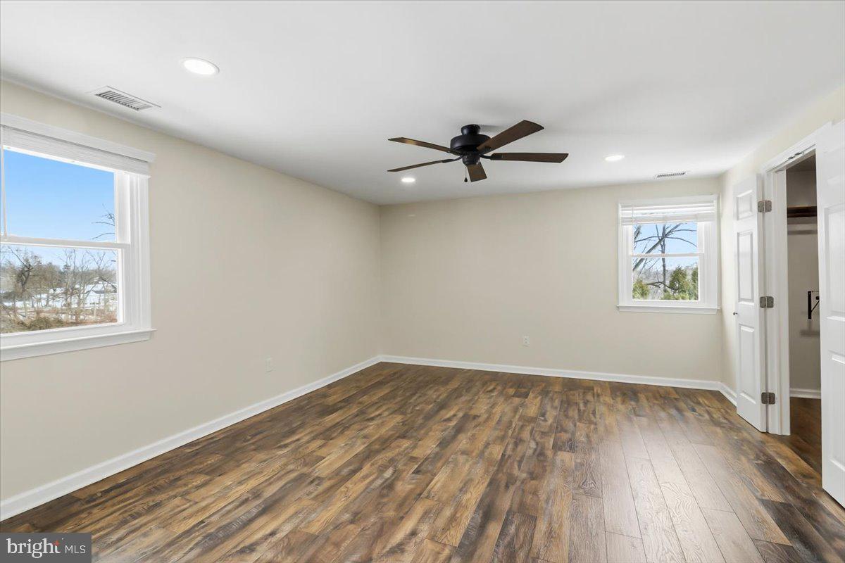 11 North Williamson Road Avondale, PA 19311 - Photo 14 of 36 a view of empty room with wooden floor and fan