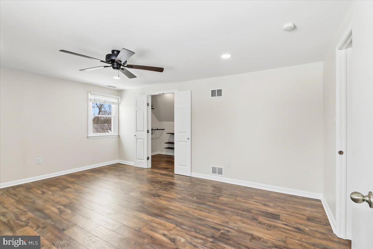 11 North Williamson Road Avondale, PA 19311 - Photo 15 of 36 a view of an empty room with a window and wooden floor