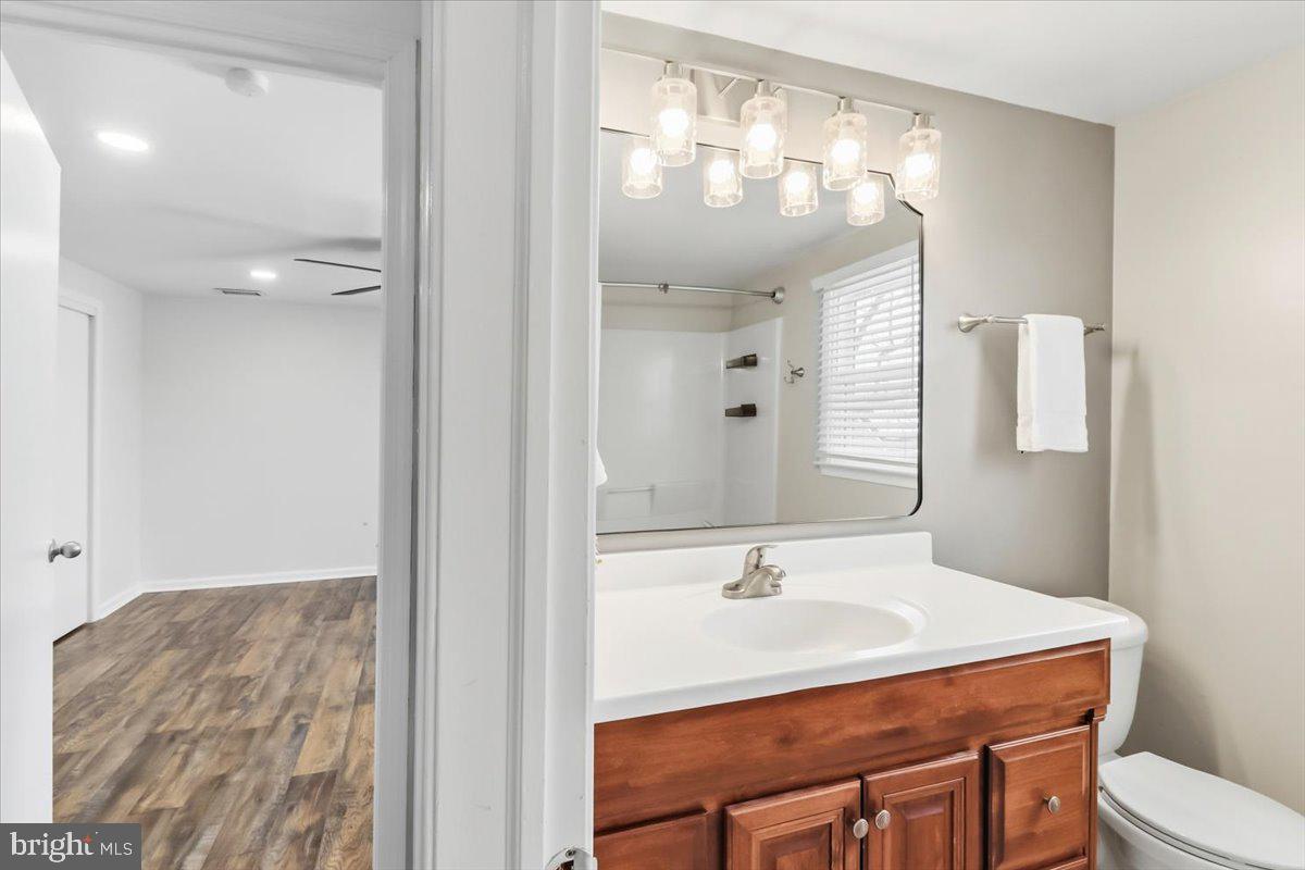 11 North Williamson Road Avondale, PA 19311 - Photo 20 of 36 a bathroom with a sink vanity mirror and toilet