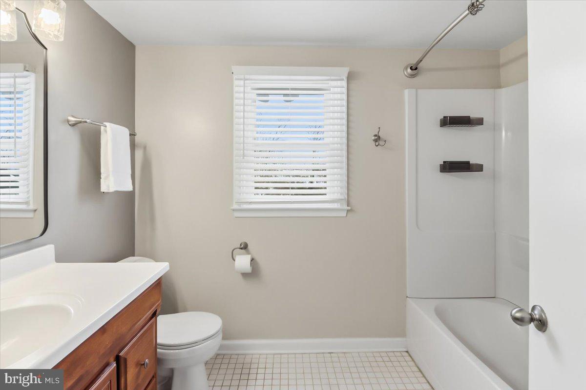 11 North Williamson Road Avondale, PA 19311 - Photo 21 of 36 a bathroom with a sink a toilet and shower