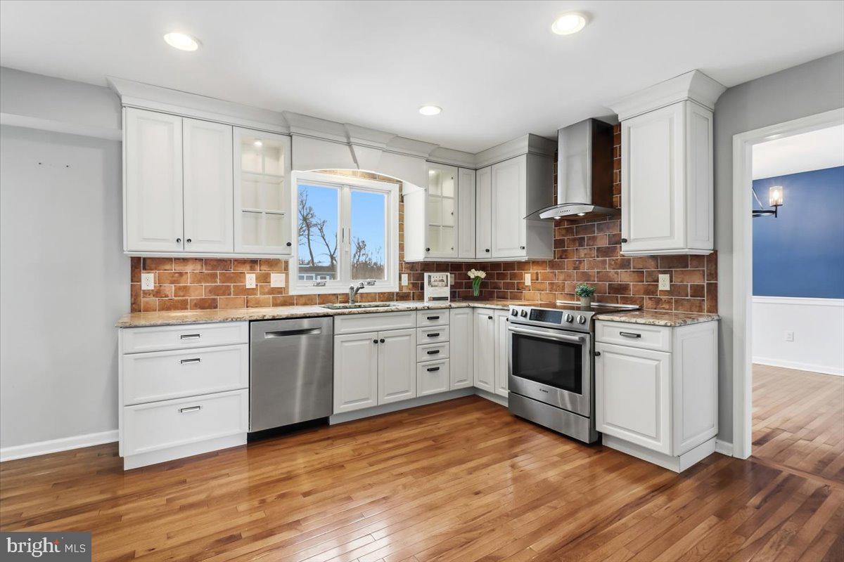 11 North Williamson Road Avondale, PA 19311 - Photo 3 of 36 a kitchen with granite countertop white cabinets and white appliances