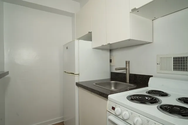 a kitchen with a stove and a refrigerator