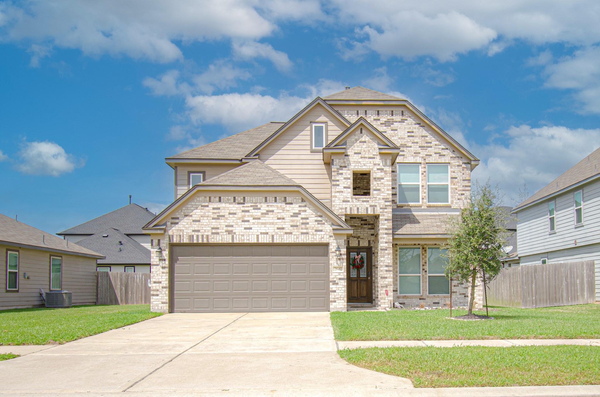 2642 Ridgeback Drive Rosenberg, TX 77471 - Photo 1 of 13 a front view of a house with a yard